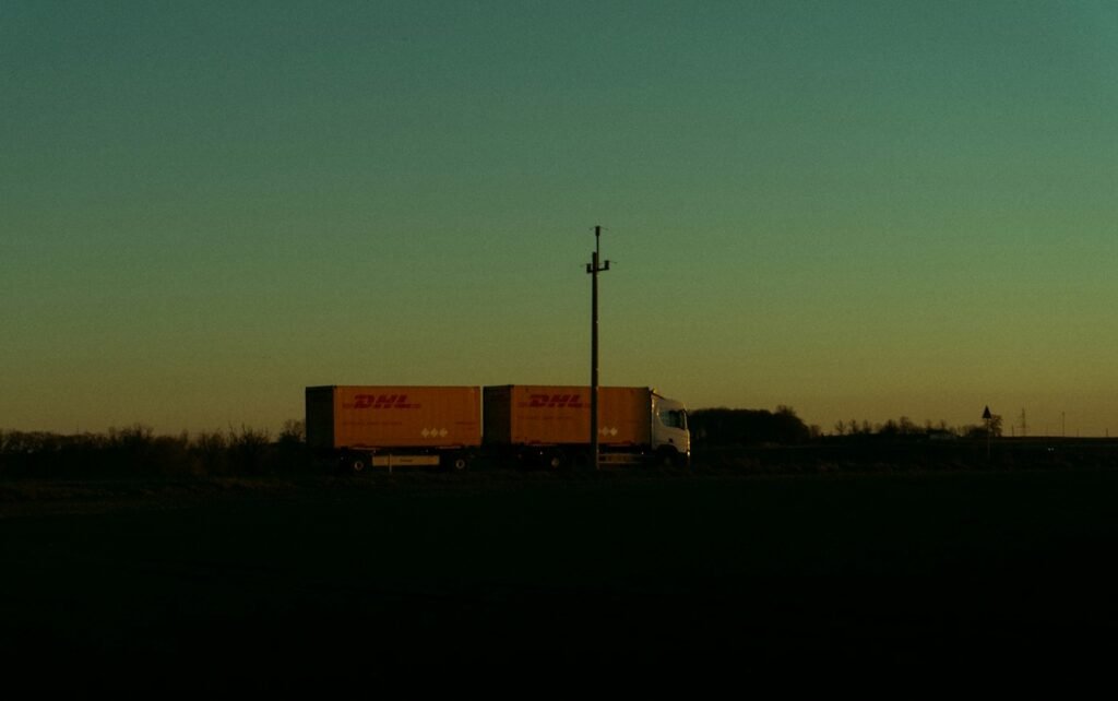 Delivery truck on the road at dusk